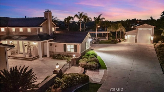 3988 Keri Way, Fallbrook, CA 92028 - view of front of house featuring concrete driveway, an outdoor structure, and a chimney