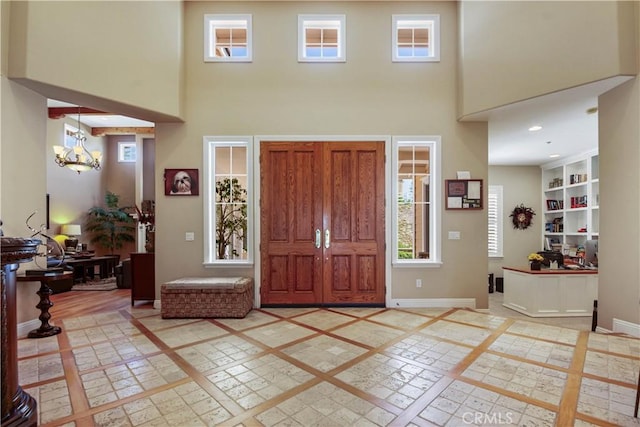 3988 Keri Way, Fallbrook, CA 92028 - entrance foyer with inlaid floor details, a high ceiling, a chandelier, and baseboards