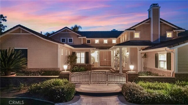 3988 Keri Way, Fallbrook, CA 92028 - view of front facade with a fenced front yard, brick siding, a gate, and a chimney