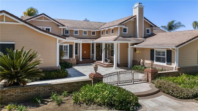 3988 Keri Way, Fallbrook, CA 92028 - view of front of home with a gate, a chimney, brick siding, and a fenced front yard
