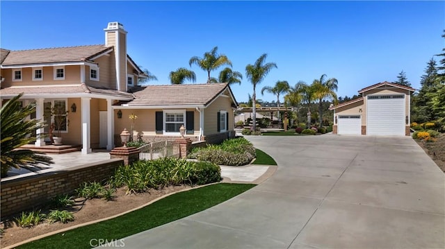 3988 Keri Way, Fallbrook, CA 92028 - view of front facade with a tiled roof, a chimney, a garage, and concrete driveway