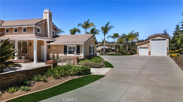 3988 Keri Way, Fallbrook, CA 92028 - view of front of house with a tiled roof, a chimney, a detached garage, and driveway