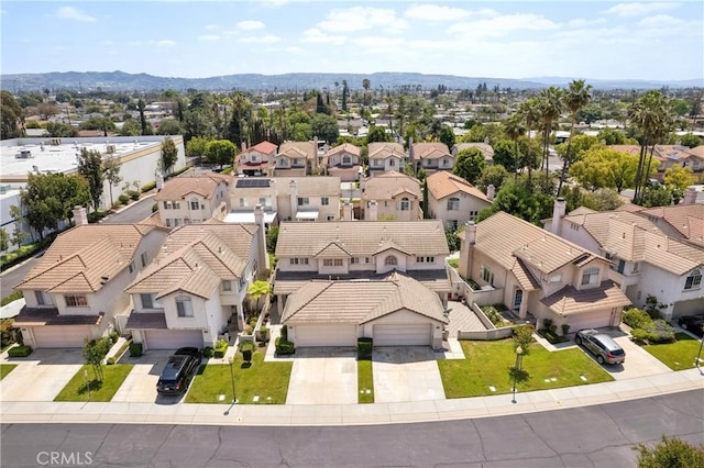 birds eye view of property featuring a mountain view and a residential view