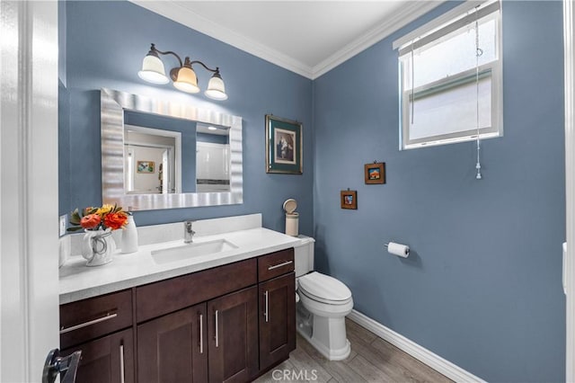 13837 Laguna St, La Mirada, CA 90638 - bathroom featuring vanity, ornamental molding, wood finished floors, toilet, and baseboards