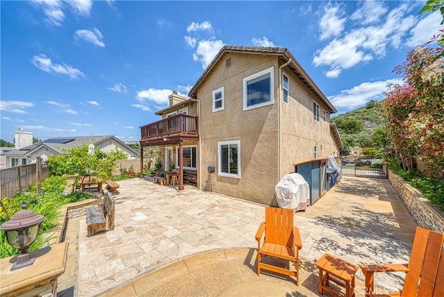 13837 Laguna St, La Mirada, CA 90638 - rear view of house with a fenced backyard, a patio area, and stucco siding