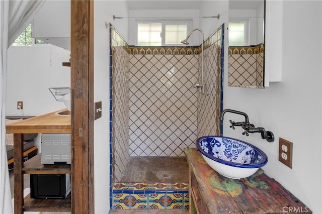 full bath featuring a sink and walk in shower