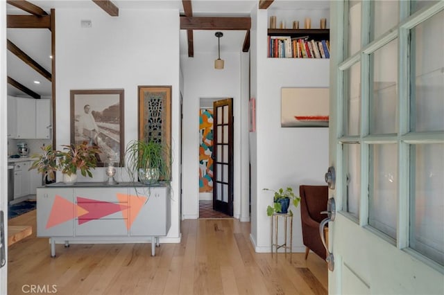 entryway featuring light wood-style floors, recessed lighting, and beam ceiling