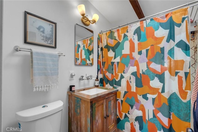 bathroom with vanity, a shower with curtain, and toilet