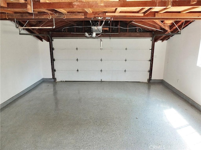 729 E Emerson Ave, Orange, CA 92865 - garage with baseboards and a garage door opener