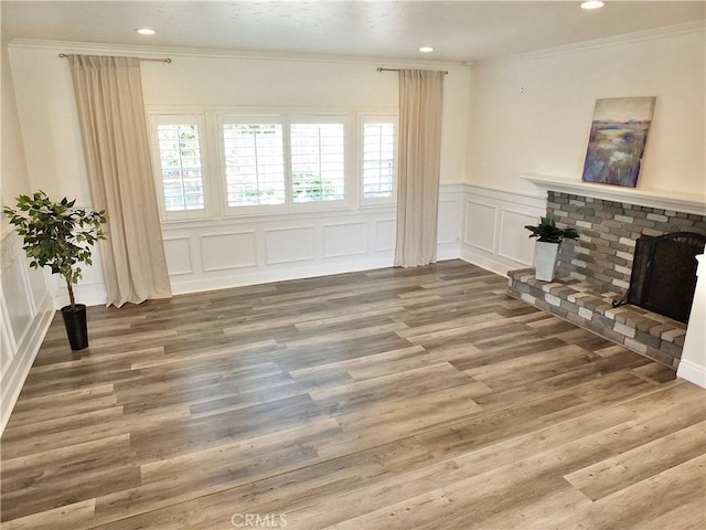 729 E Emerson Ave, Orange, CA 92865 - living area with crown molding, wood finished floors, a wainscoted wall, a decorative wall, and recessed lighting