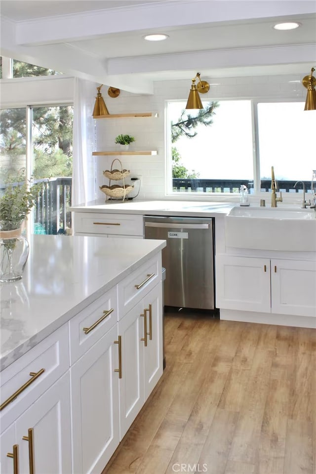 2012 Poplar Dr, Running Springs, CA 92382 - kitchen featuring stainless steel dishwasher, beamed ceiling, a sink, white cabinetry, and light wood-type flooring