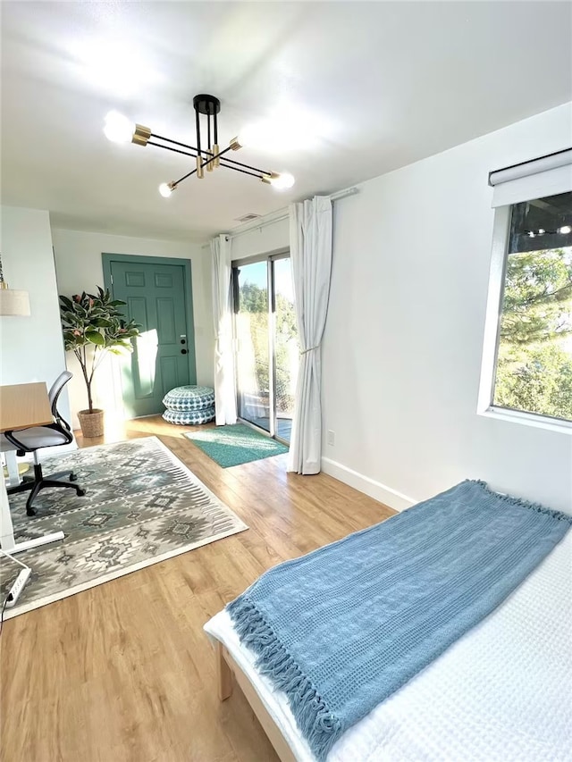 2012 Poplar Dr, Running Springs, CA 92382 - bedroom featuring access to outside, light wood-style floors, a chandelier, and baseboards