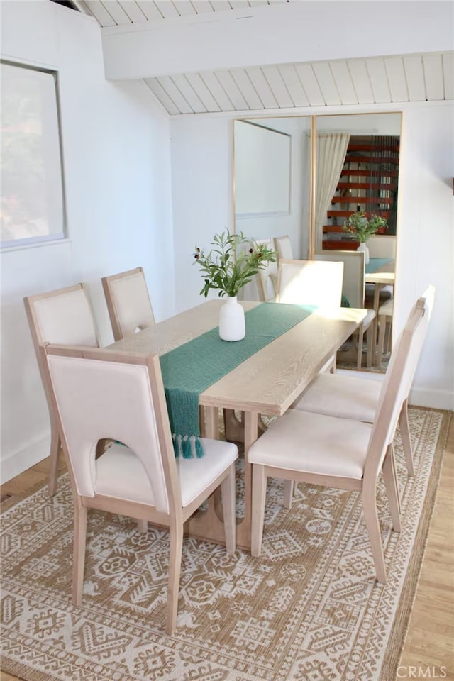 2012 Poplar Dr, Running Springs, CA 92382 - dining area with wood finished floors, beam ceiling, baseboards, and wood ceiling
