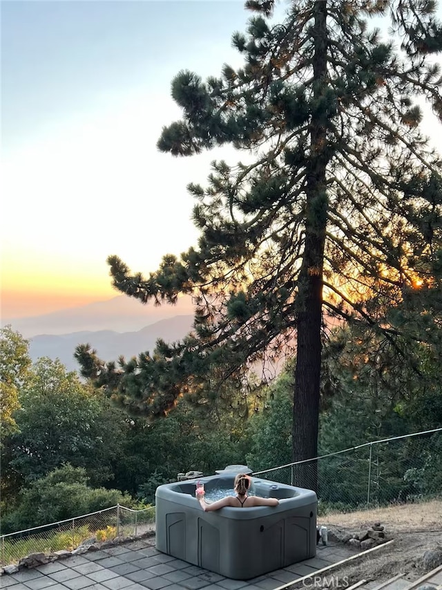2012 Poplar Dr, Running Springs, CA 92382 - exterior space with a hot tub and fence
