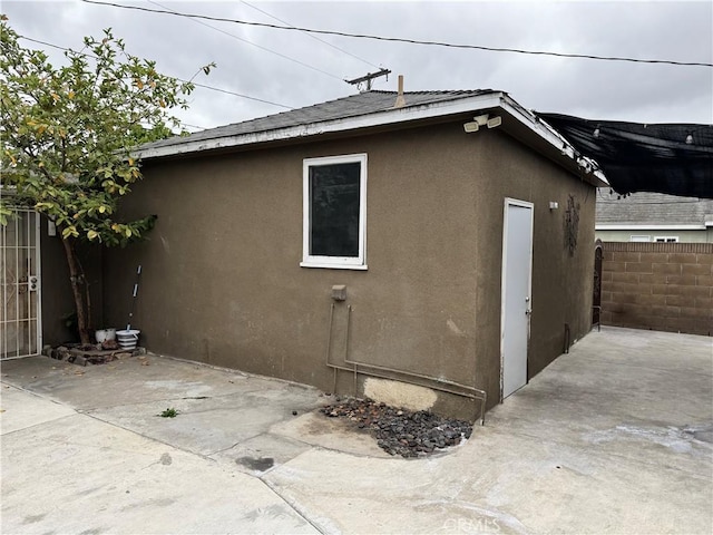 812 N Dickel St, Anaheim, CA 92805 - view of side of home featuring a patio area, fence, and stucco siding