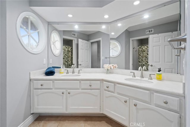full bathroom with recessed lighting, visible vents, and a sink