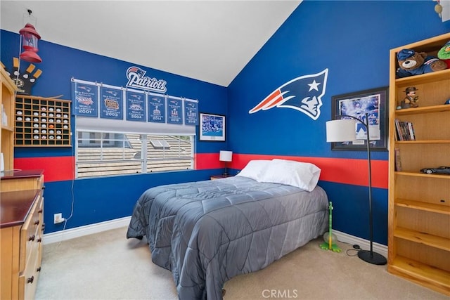 bedroom with carpet floors, baseboards, and vaulted ceiling