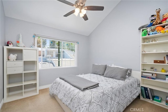 carpeted bedroom featuring baseboards, ceiling fan, and lofted ceiling