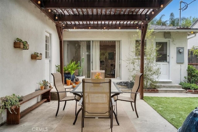 view of patio featuring a pergola and outdoor dining space