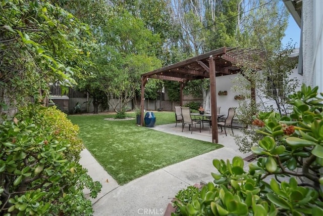 view of yard with a fenced backyard, a pergola, and a patio