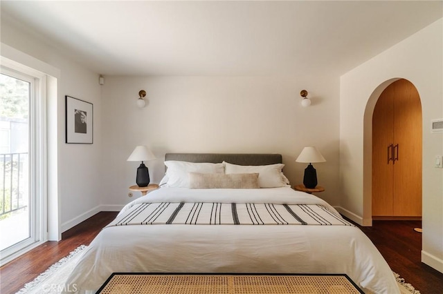 1541 Indiana Ave, South Pasadena, CA 91030 - bedroom featuring arched walkways, baseboards, and wood finished floors