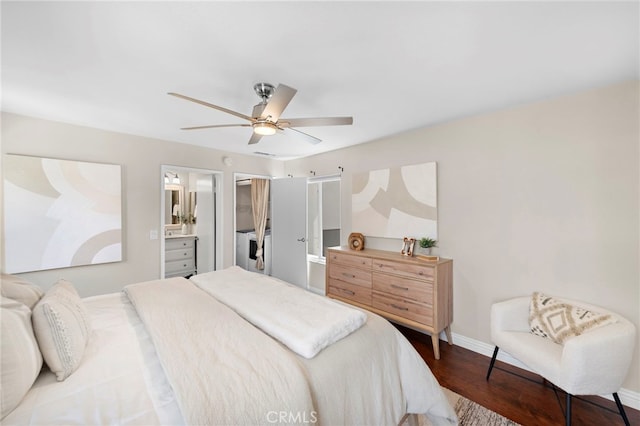 bedroom with baseboards, ensuite bath, wood finished floors, and ceiling fan