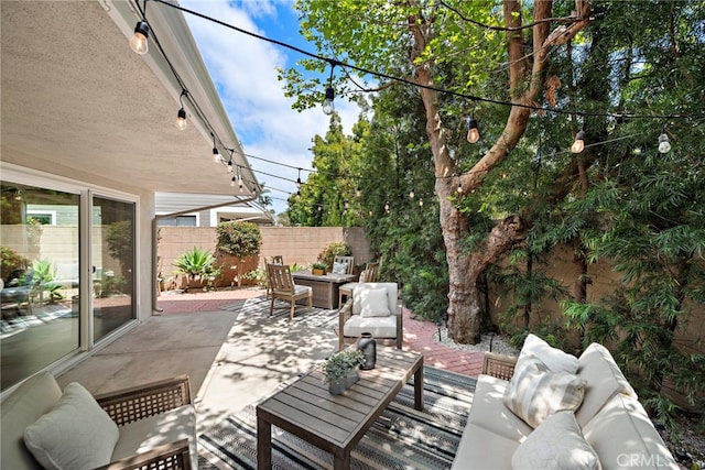 view of patio with fence and an outdoor hangout area