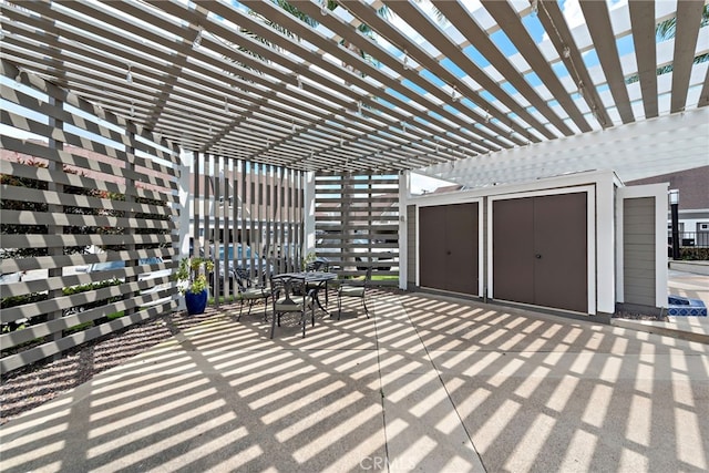 view of patio with a pergola and outdoor dining space