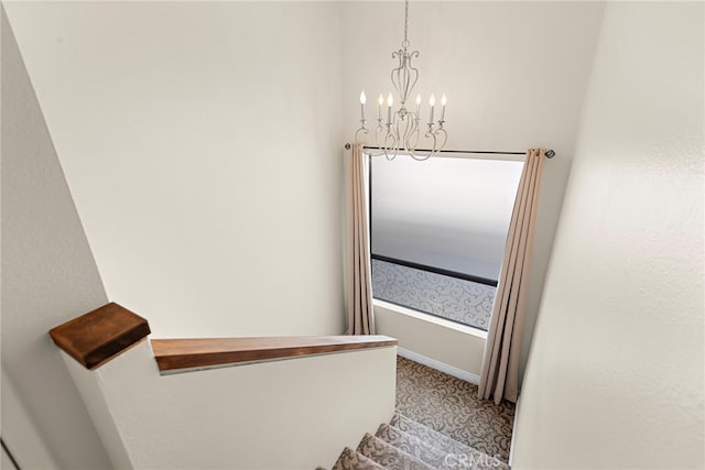 interior space with an inviting chandelier and carpet