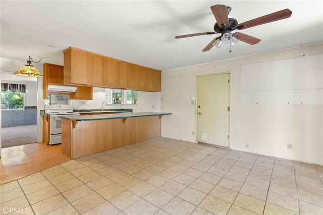 kitchen with under cabinet range hood, a breakfast bar, white electric stove, and a wealth of natural light