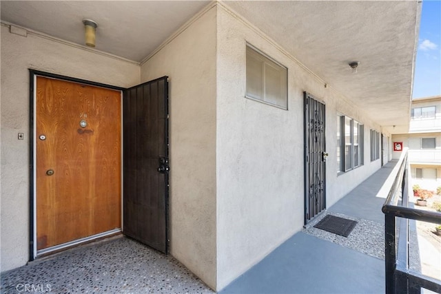 doorway to property with stucco siding