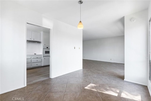spare room with tile patterned flooring