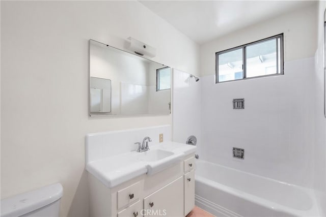full bath with shower / bath combination, vanity, and toilet