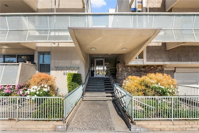 entrance to property featuring stone siding