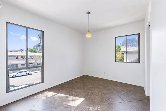 tiled spare room with baseboards