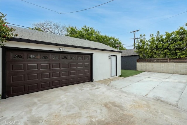 garage featuring fence