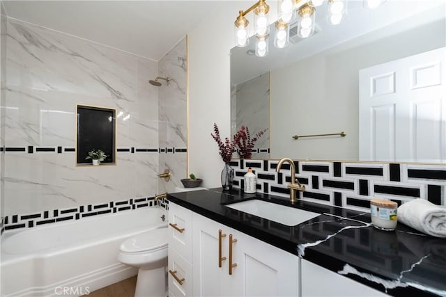 full bathroom featuring vanity,  shower combination, and toilet