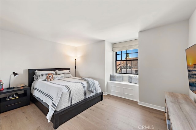 9401 Gateshead Dr, Huntington Beach, CA 92646 - bedroom with baseboards and light wood-style flooring