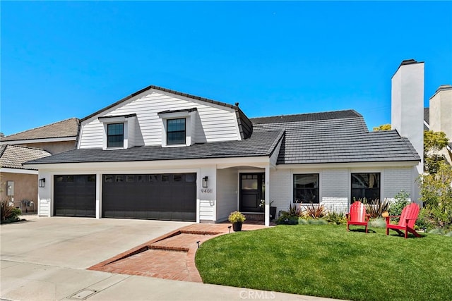 9401 Gateshead Dr, Huntington Beach, CA 92646 - view of front of home featuring an attached garage, a front lawn, brick siding, a chimney, and concrete driveway