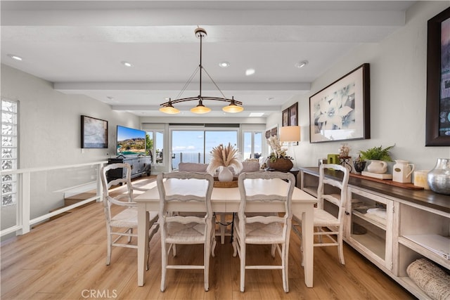 dining space with light wood-style floors, beam ceiling, and recessed lighting