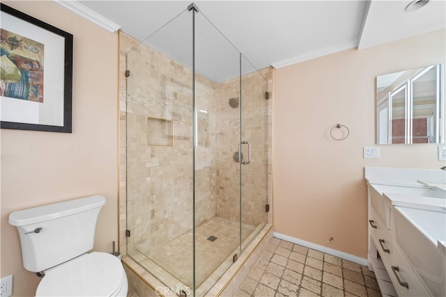 full bath featuring a stall shower, baseboards, toilet, ornamental molding, and vanity