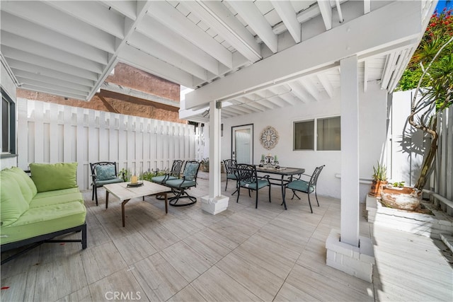 deck with an outdoor hangout area, outdoor dining space, a fenced backyard, and a patio area