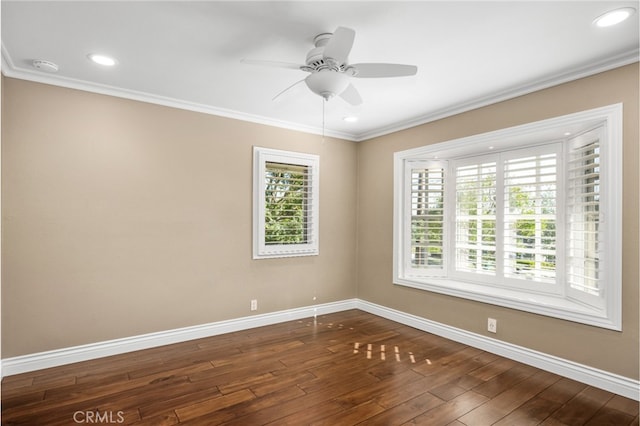 spare room featuring dark wood-style flooring, ceiling fan, recessed lighting, baseboards, and ornamental molding
