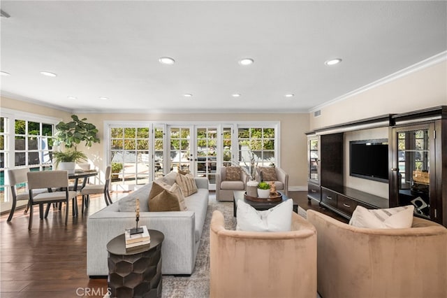 living room featuring recessed lighting, ornamental molding, wood finished floors, and plenty of natural light