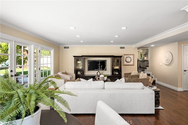 living room featuring recessed lighting, visible vents, and ornamental molding