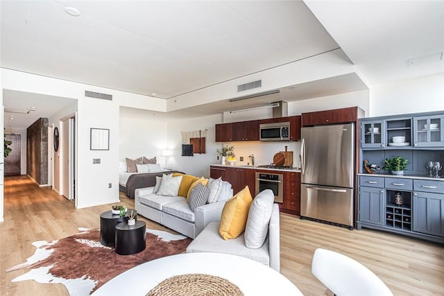 1155 S Grand Ave Unit 1011, Los Angeles, CA 90015 - living room featuring light wood-style floors