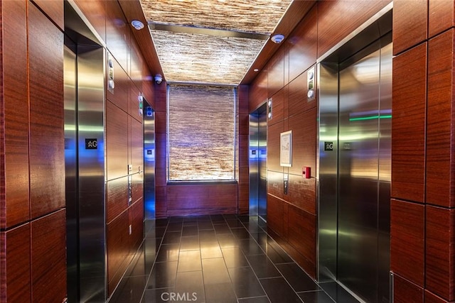1155 S Grand Ave Unit 1011, Los Angeles, CA 90015 - corridor with elevator and dark tile patterned floors
