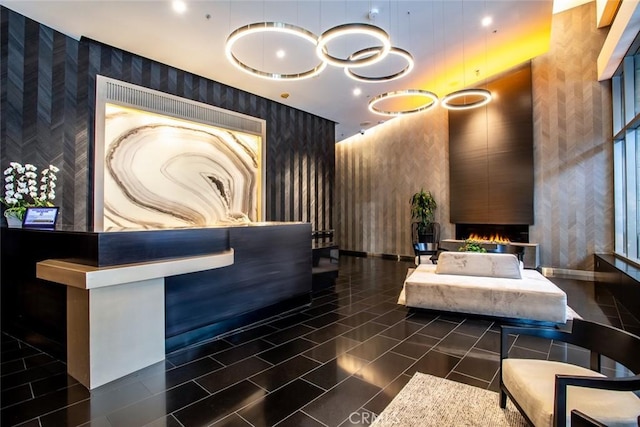 1155 S Grand Ave Unit 1011, Los Angeles, CA 90015 - reception with wallpapered walls and a lit fireplace