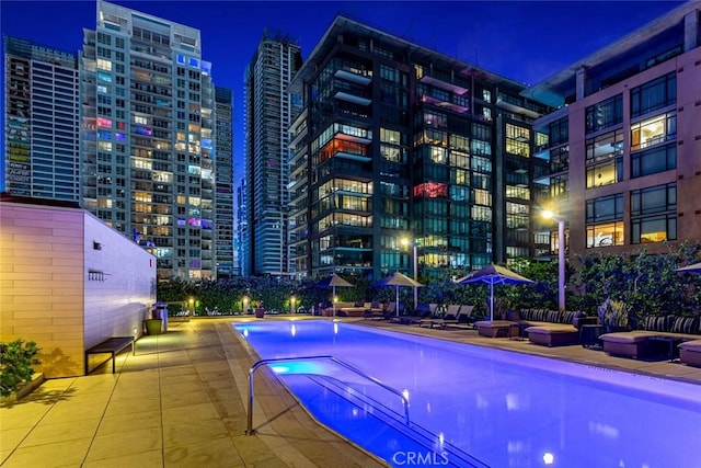 1155 S Grand Ave Unit 1011, Los Angeles, CA 90015 - pool at night with a community pool and a view of city lights