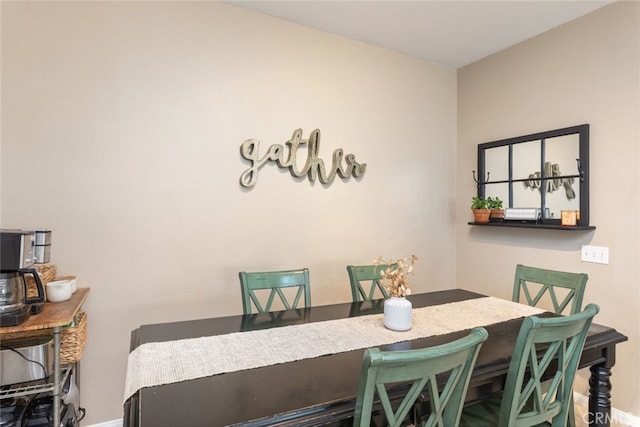 dining space with baseboards